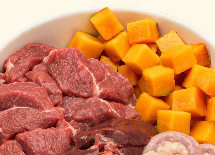 Bowl of beef meat, pumpkin, beef liver and tripe